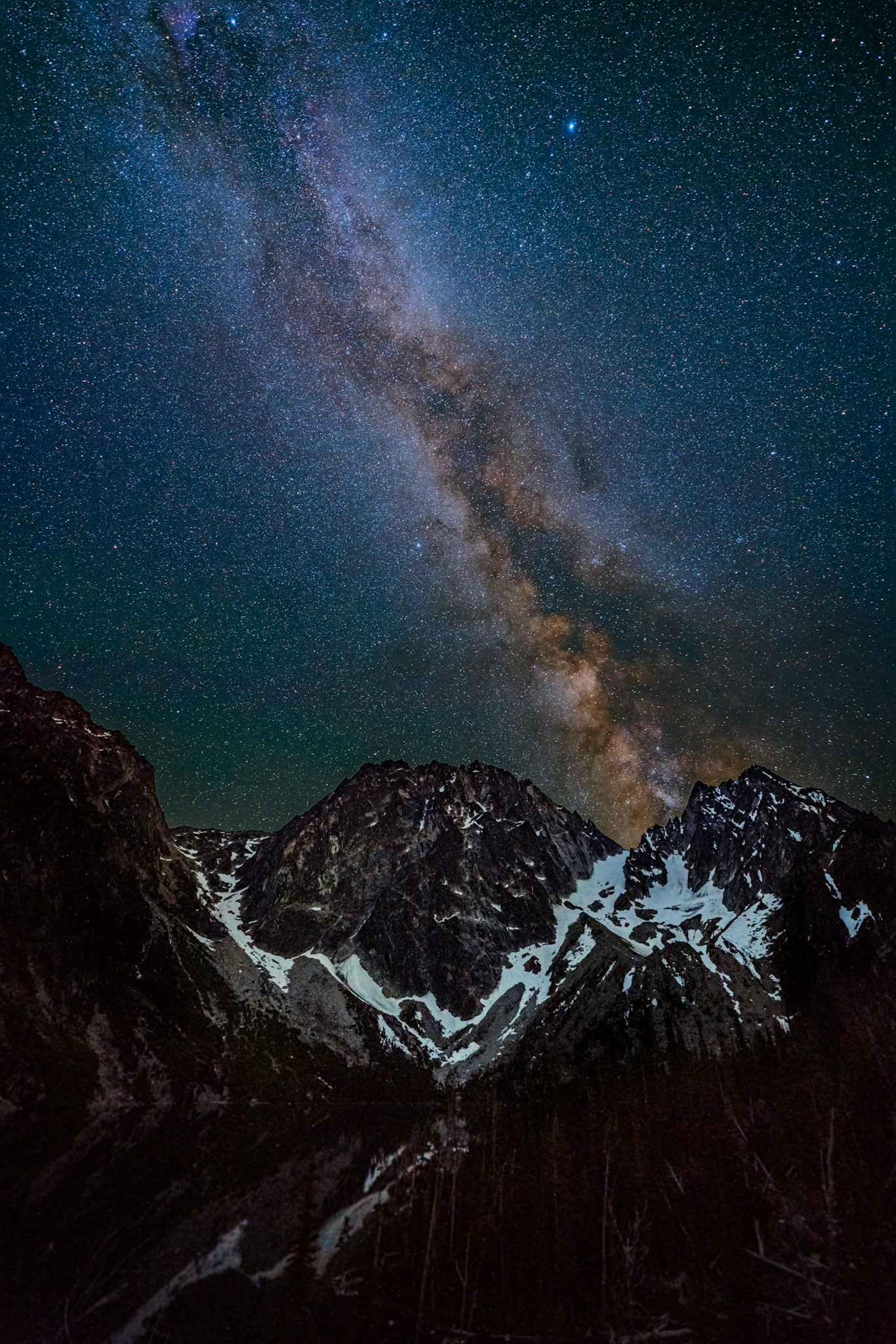 The milky way rises over Dragontail and Colchuck peaks in the Alpine Lakes Wilderness of WA.
