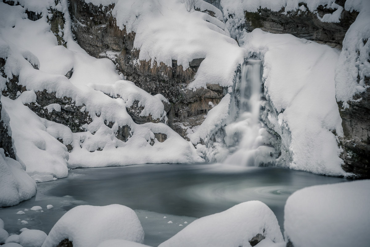 a snowy creek on a cold winter day