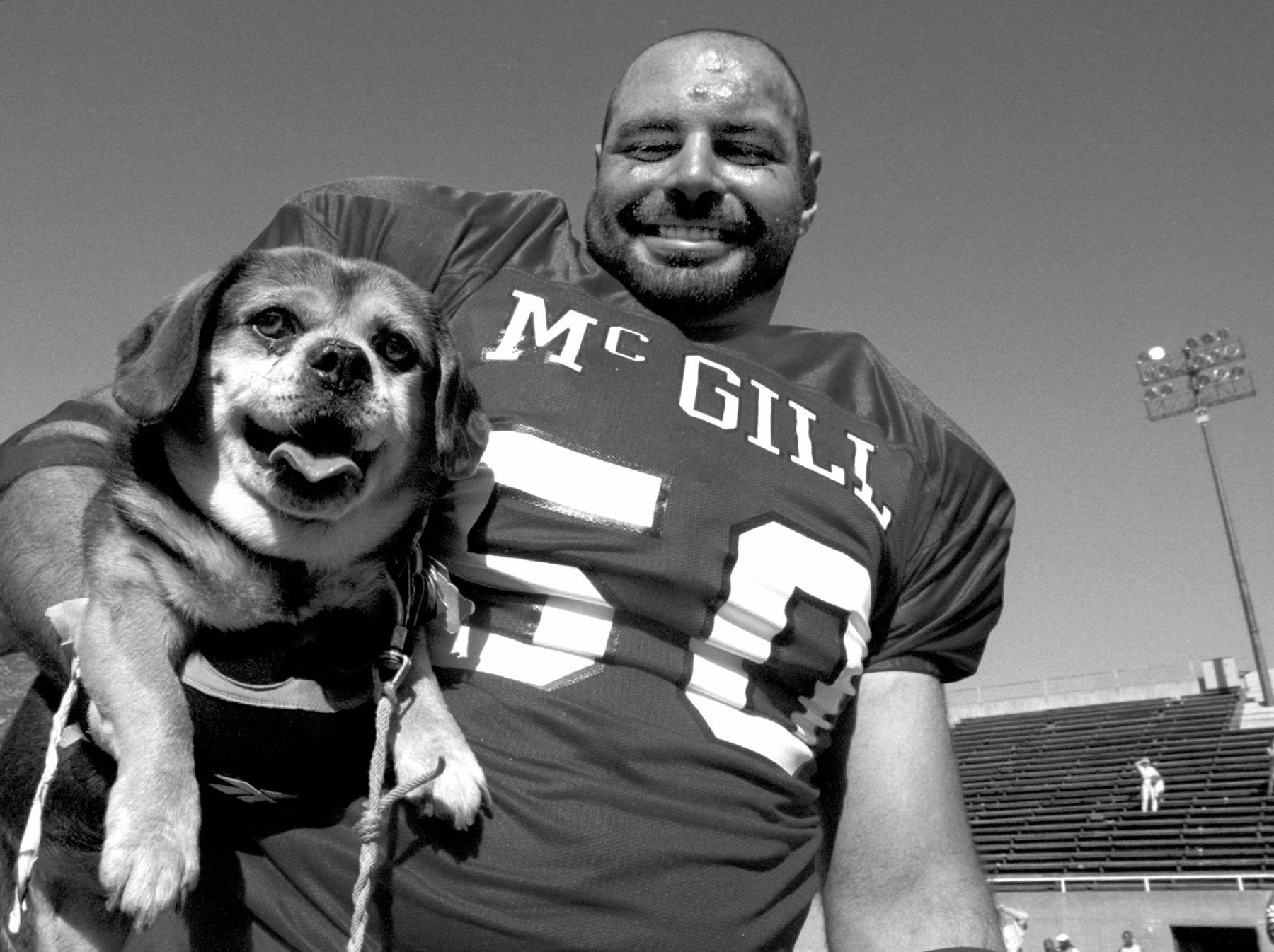 Post-game dog-holding. August 1997.