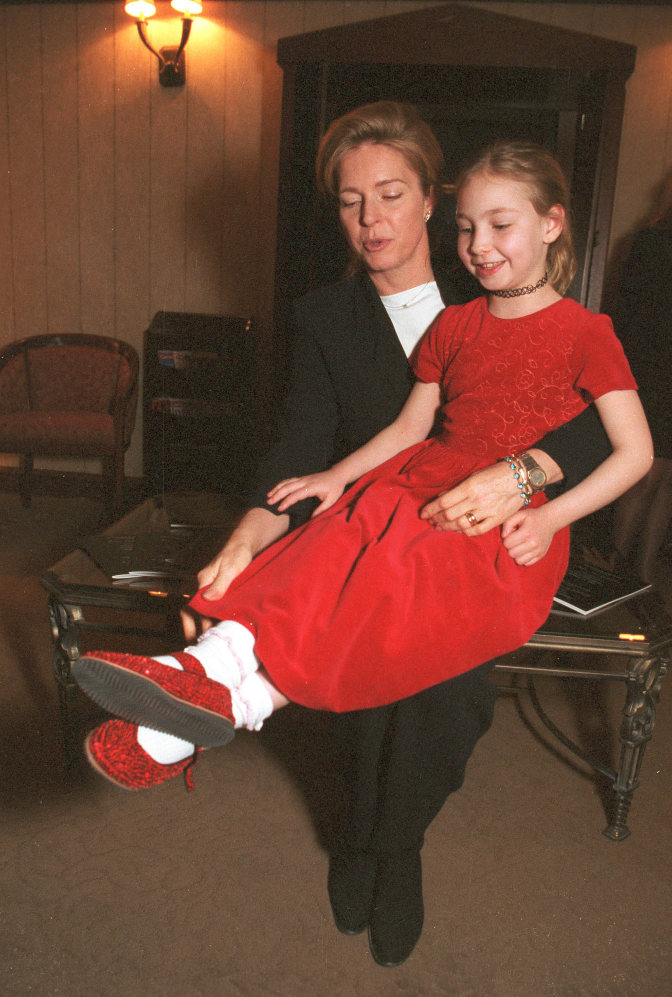 Queen Noor admires the shiny shoes. March 2000.