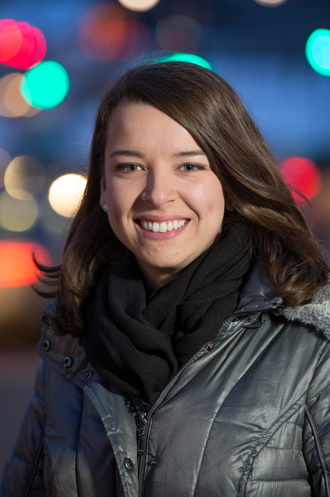 Simone Cavanaugh, 2017 grad from the Faculty of Law, and founder of Pivot International. The background is of mix of car taillights and traffic signals at the Pine-Parc intersection. 