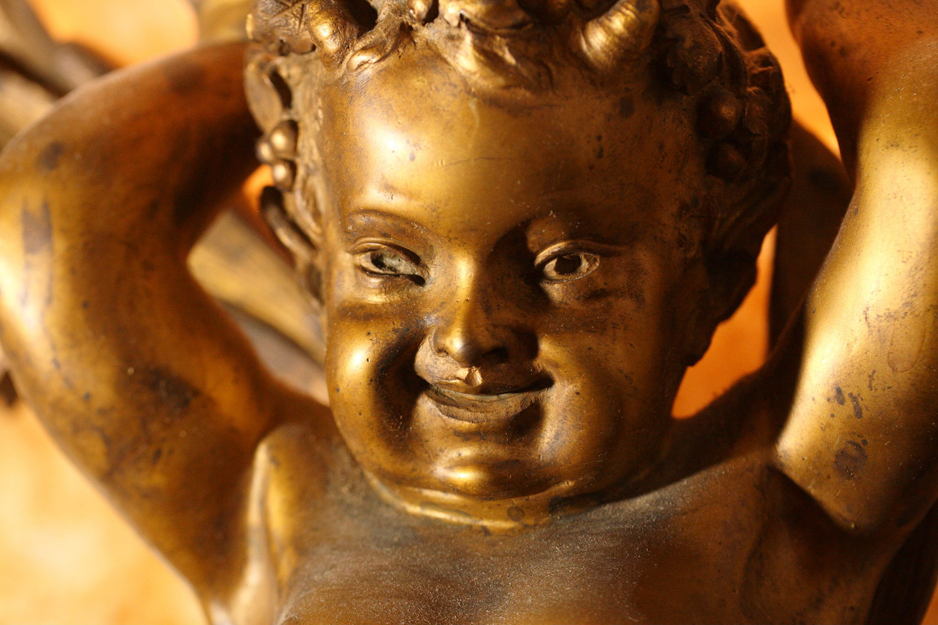 Not sure whether this is a cherub or a "putto", but he *is* on the Faculty Club wall.
