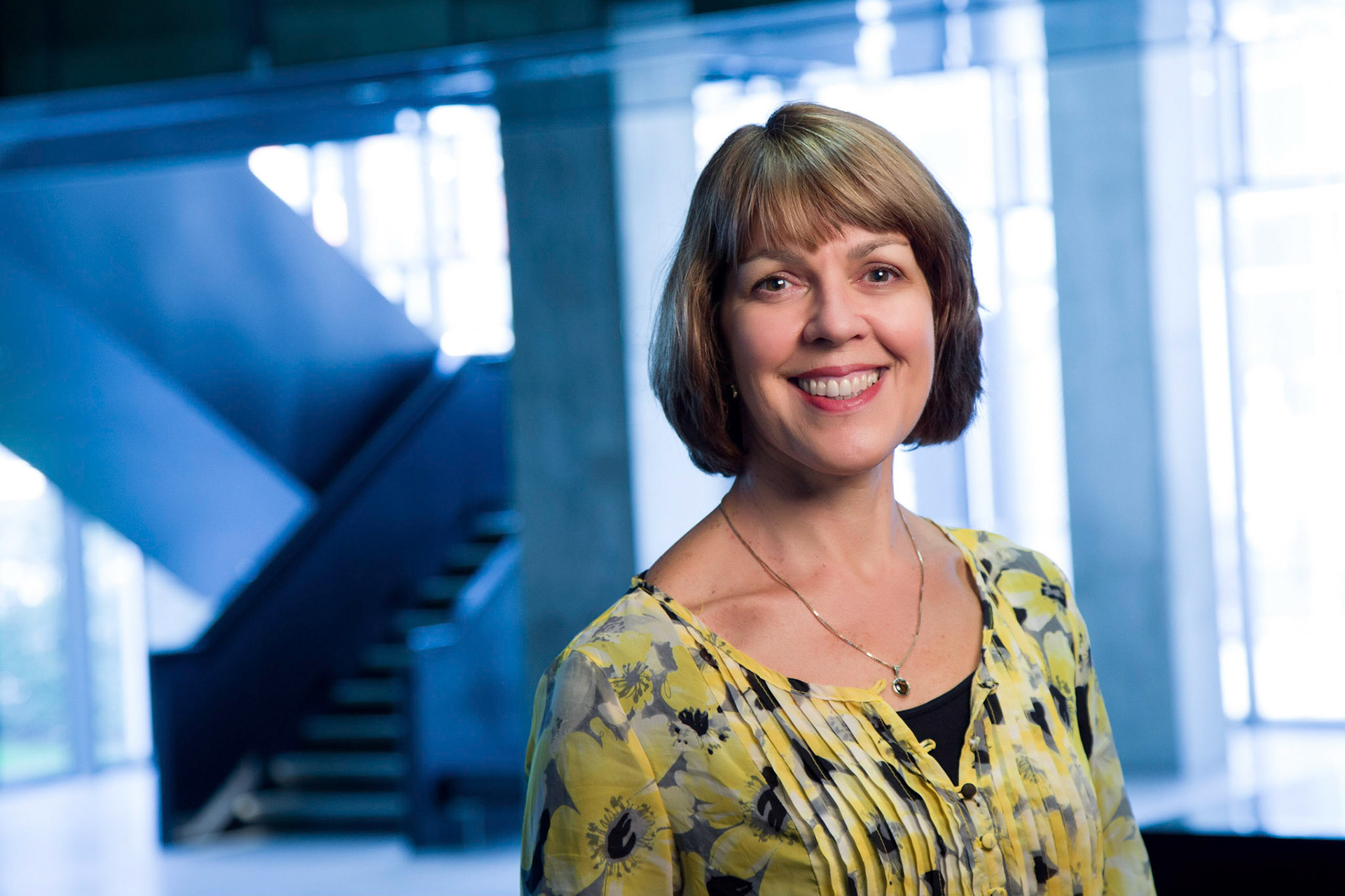  Brenda Ravenscroft, Dean, Schulich School of Music. For this shot we lit the Dean with an orange-gelled flash, but told the camera that the orange tone was normal. This made everything not lit by the flash (i.e. the background) appear quite blue.