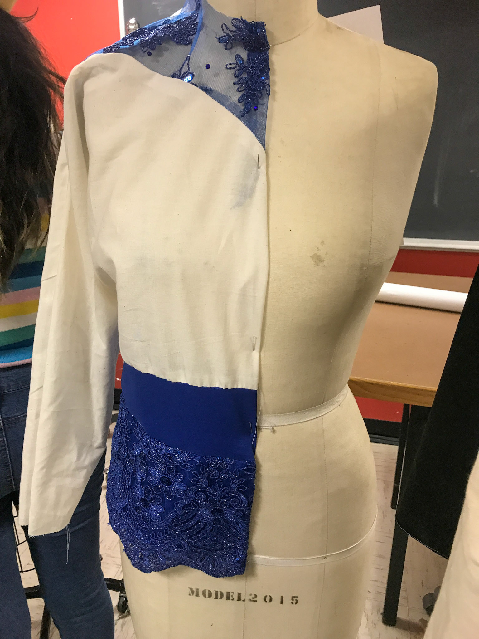 Dolman sleeve with embroidered mesh