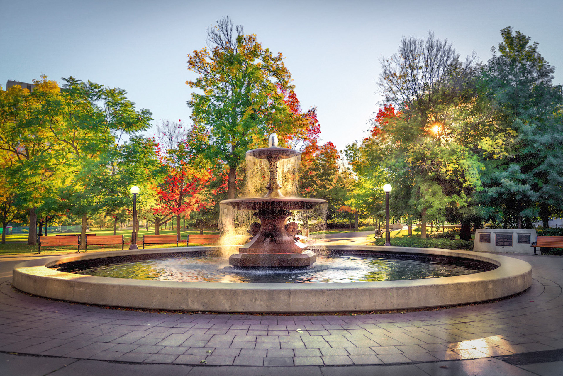 Autumn sunlight glancing through the water of the Confederation Park fountain