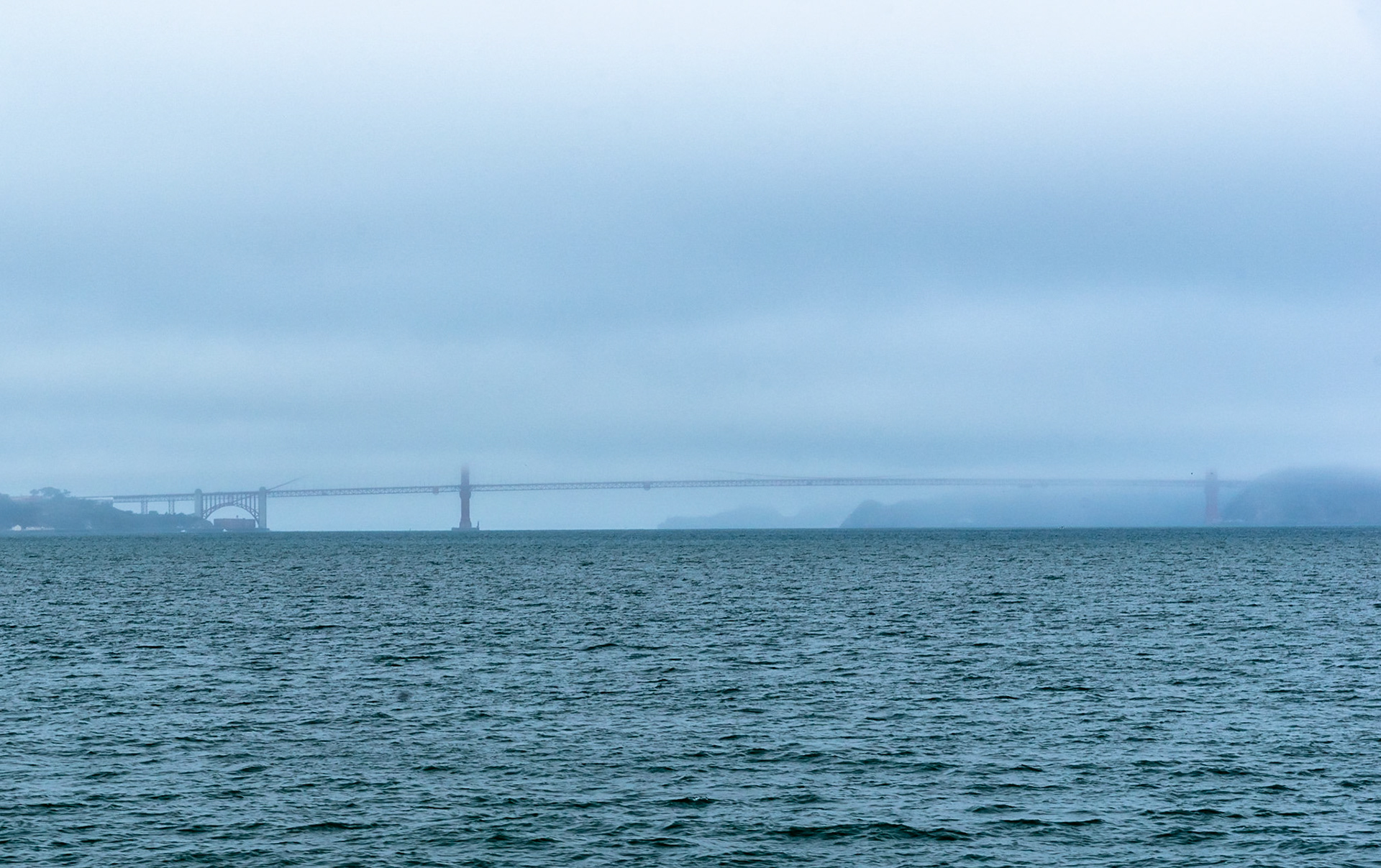 Mist shrouded Golden Bay Bridge, San Fransisco Bay, California