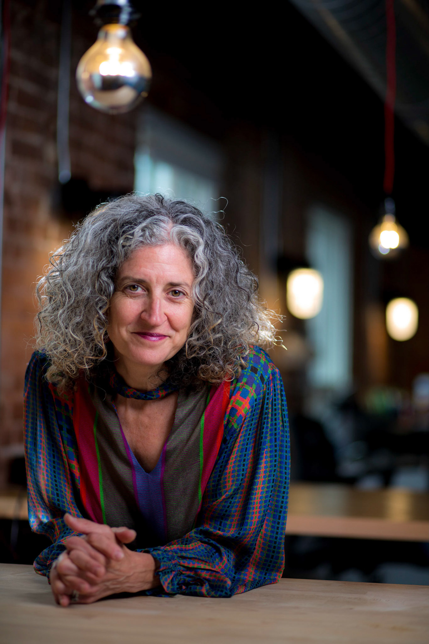 Portraits and headshots of Mikaela Seligman, CEO of AchieveMission.