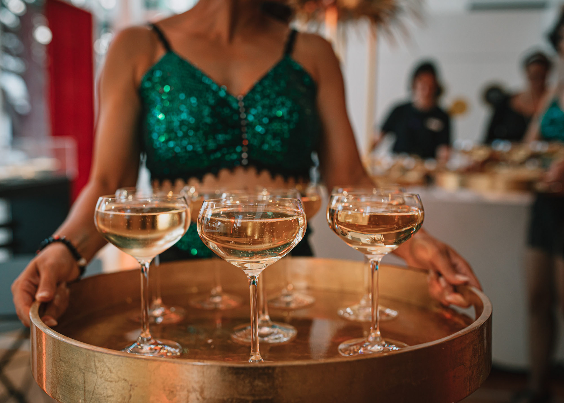 Deco Dancers serve guests bubbles on arrival
