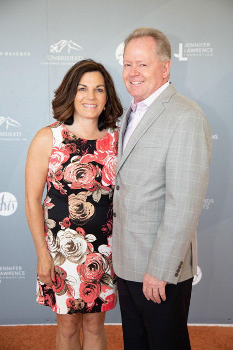 Becky and University of Louisville Football Coach Bobby Petrino.