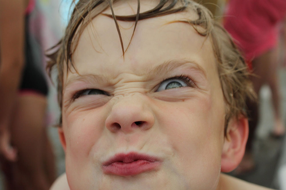 Boy with a funny face.