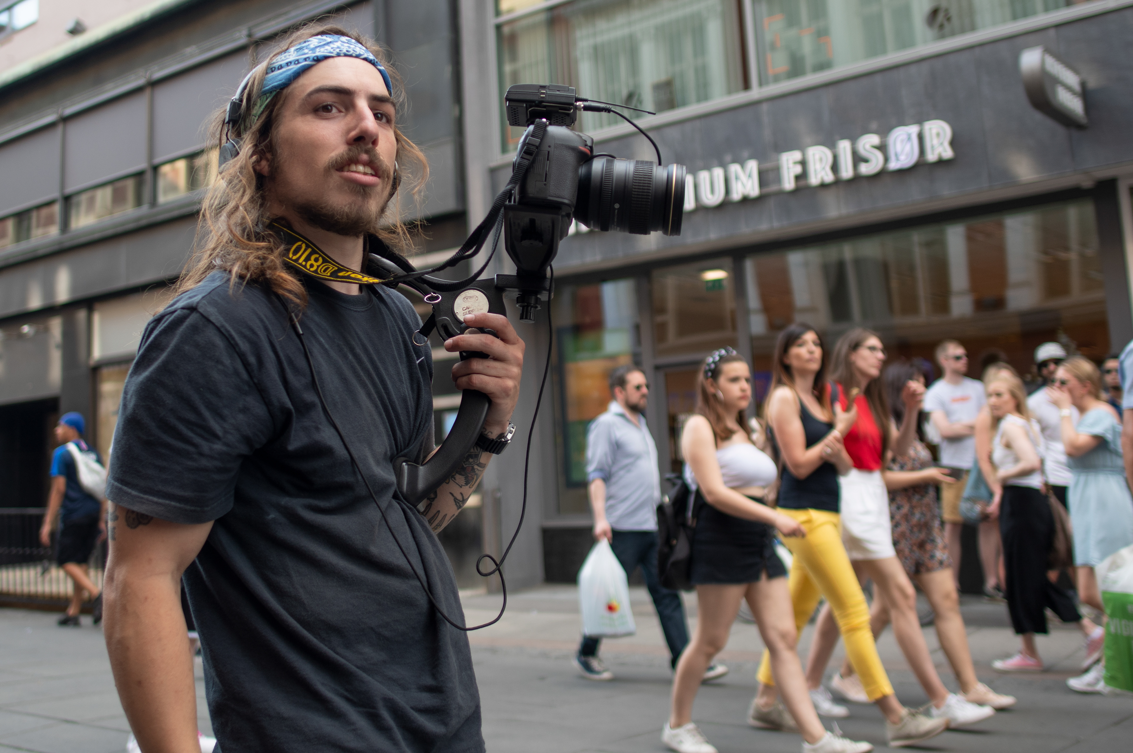 Billy Ray Malone shooting street musicians in downtown Oslo.