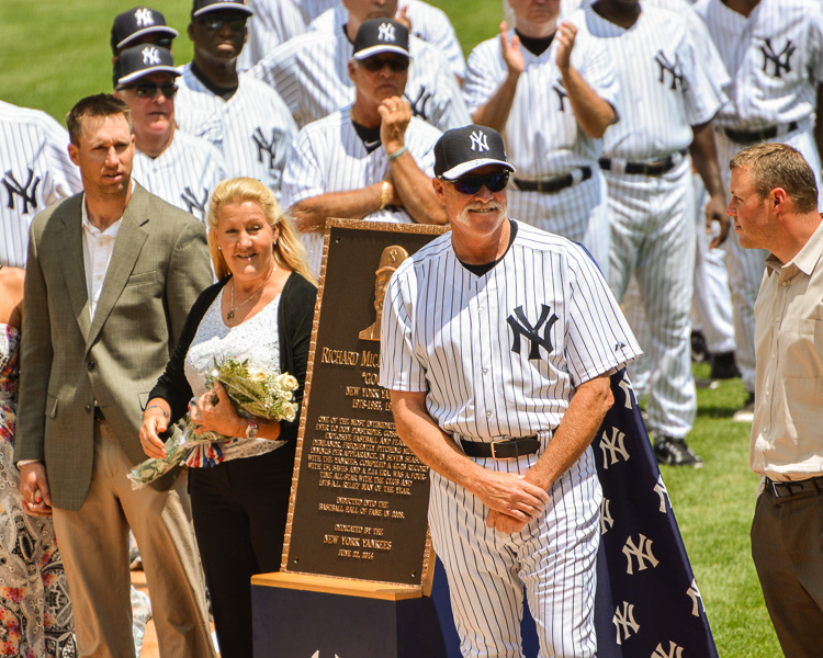 Retired New York Yankee pitcher Goose Gossage waves while standing with his  monument that will be placed in Monument Park at the 68th Annual  Old-Timers' Day before the New York Yankees play