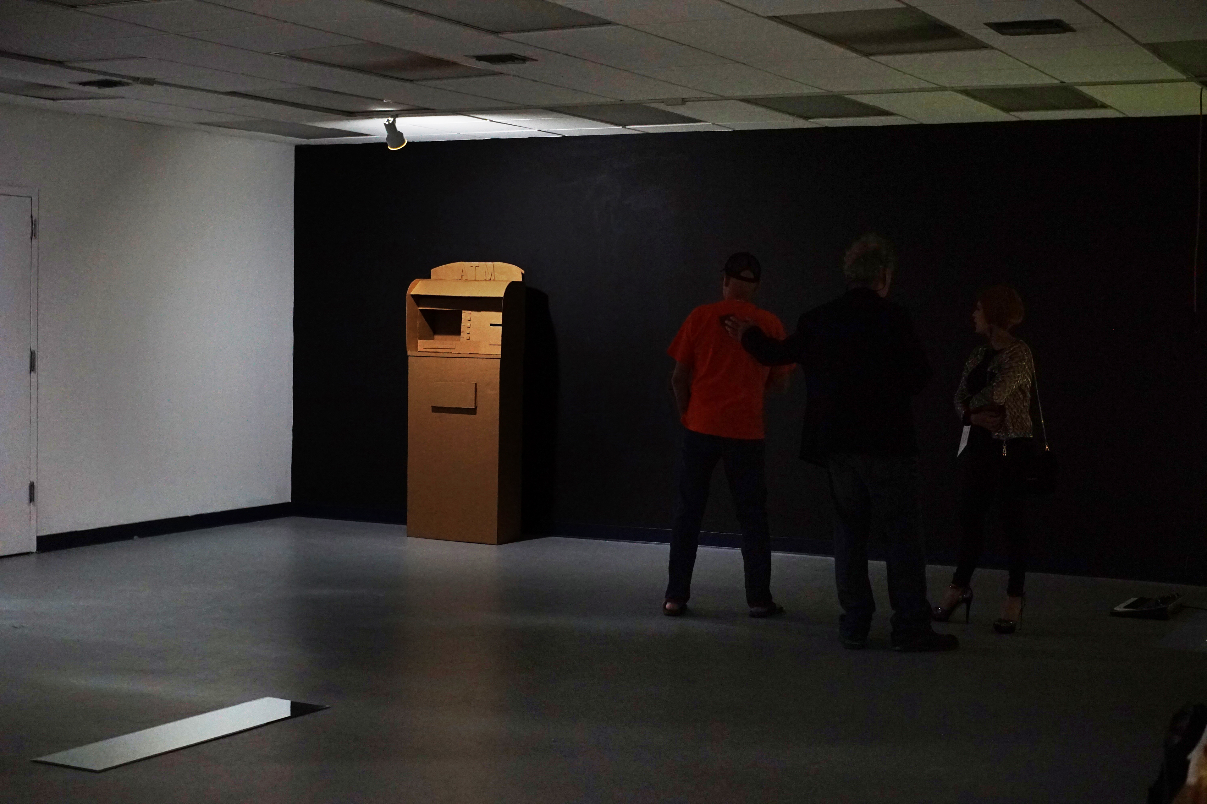 Arina Polyanskaya, "In ATM", 2018 Carton board Performance, 66 × 27 × 13 inches