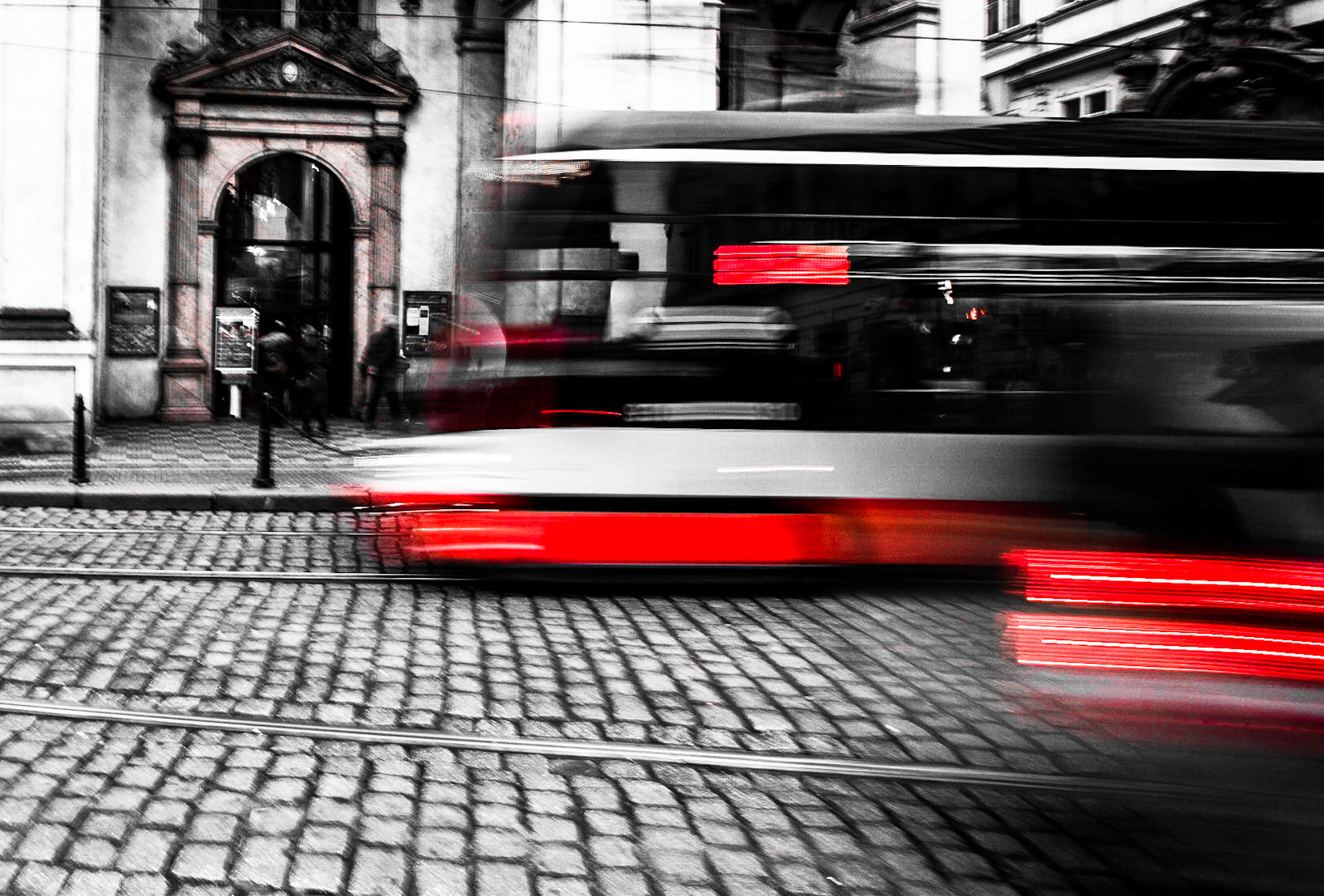 Tram in Prague in front of St Salvator Church with cool blurring