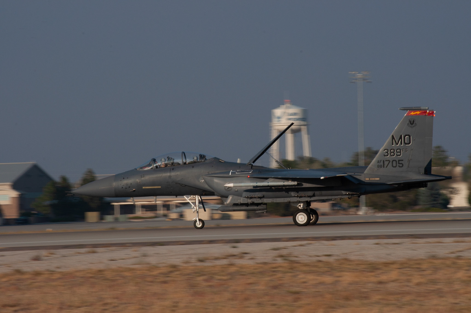 1705 Panning: A/C 1705, landing sequence, 20201002 @ 1814 evening sun, Mountain Home AFB, Miller, I wanted to find a subject that I could capture in high speed during different times of the day and play with the light source. This is one of my favorites because the sun was in just the right position to capture the detail of the plane, and loved getting the water tower in the back to blur out. Camera Settings: Nikon D500, ISO 200, 200mm, f/22, 1/100s