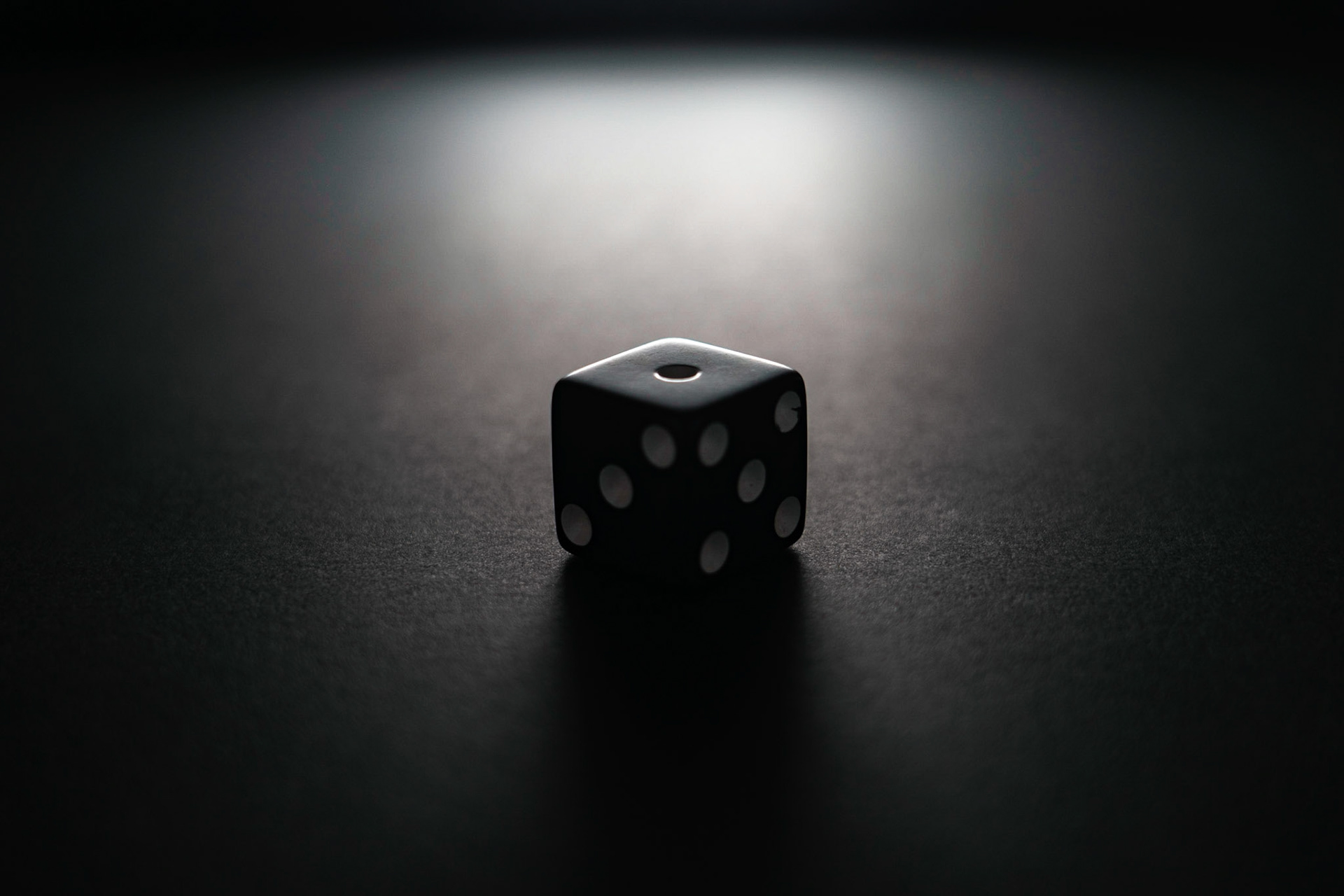 Backlighting: Dice on black paper, 20201107, MILLER, Backlighting was one of the hardest techniques of the 10 used for this shoot. Utilizing backlighting, I had to put white paper up around my lens to reflect light back to the front of the dice in order for it to not be completely lost in the black shadow. I enjoy the balance of the grey scale in this photo and how the white dots are still visible with in the dark shadow casted by the backlighting. Camera Settings: Sony A7II, ISO 200, 55mm, f4.5, 1/30s