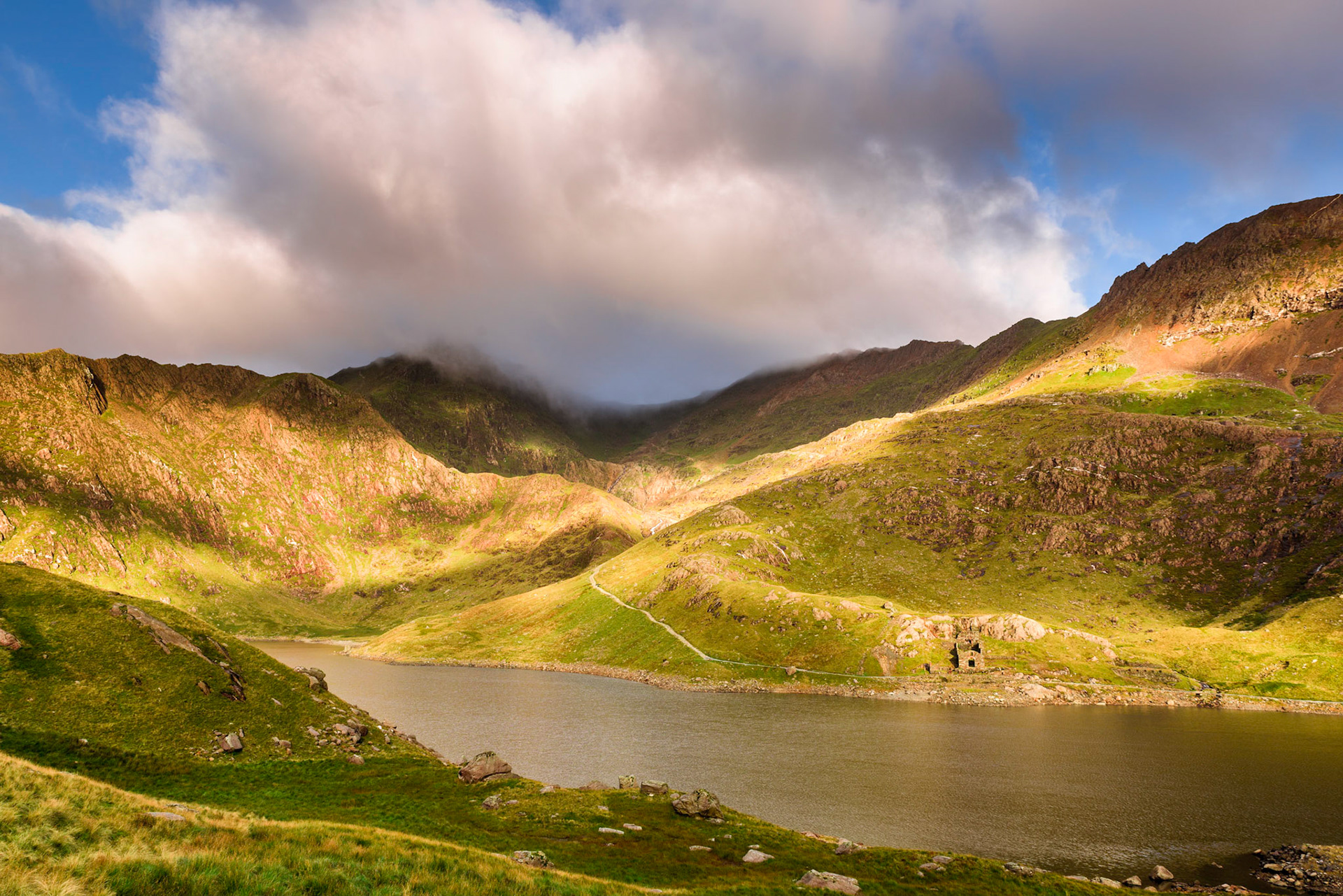 Early morning light over Llyn Llydaw with Brittania Copper Mines buildings, Snowdonia, Wales, UK