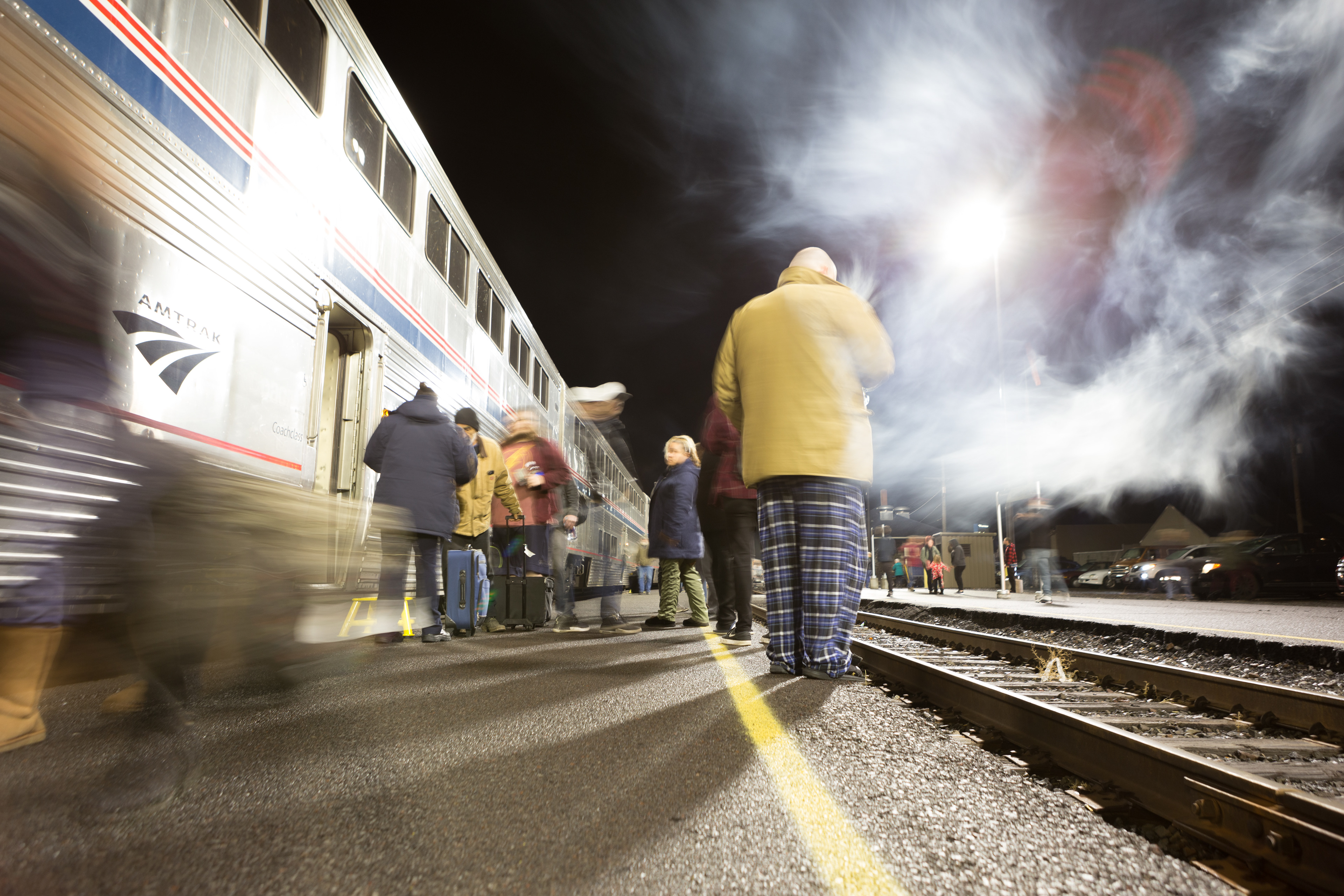 Amtrak passengers walk on the platform at Klamath Falls station as they wait for the train to depart in December 2018.