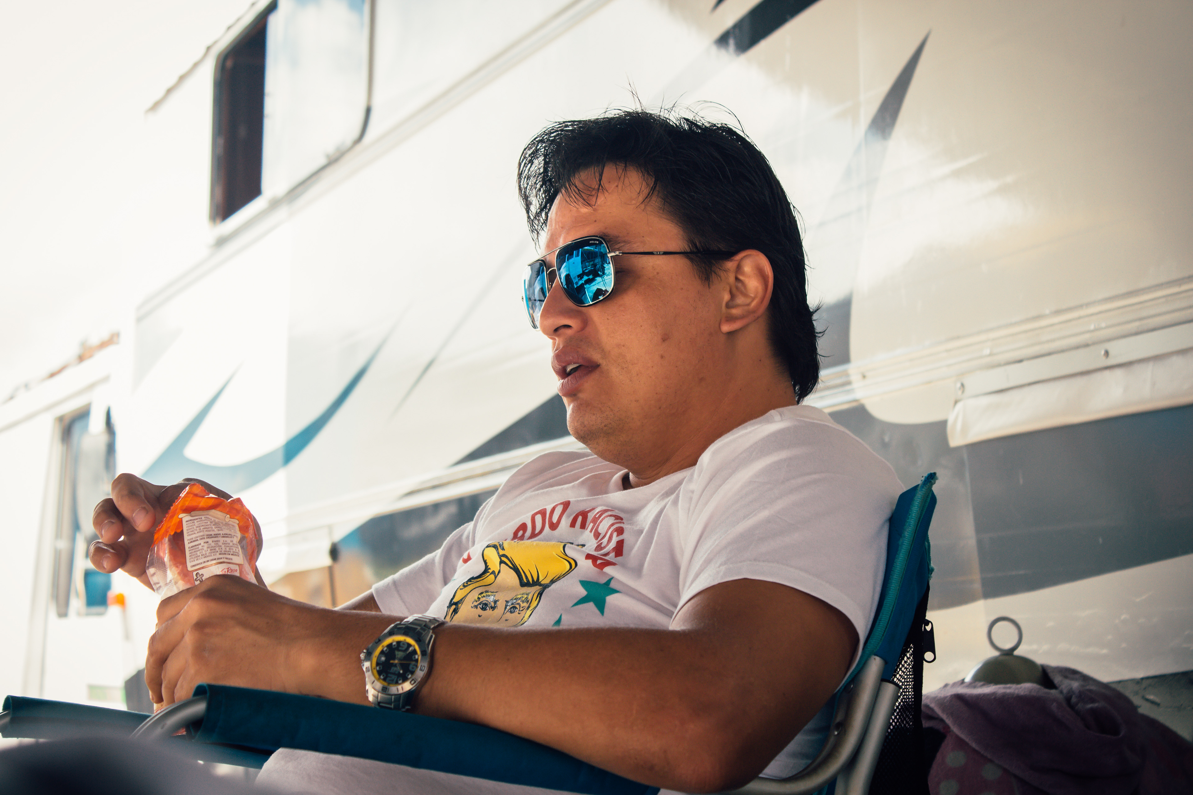 Mr. Chicharron, husband of Africa, the owner of the Circus, sits as his trailer while supervising the disassembling of the tent
