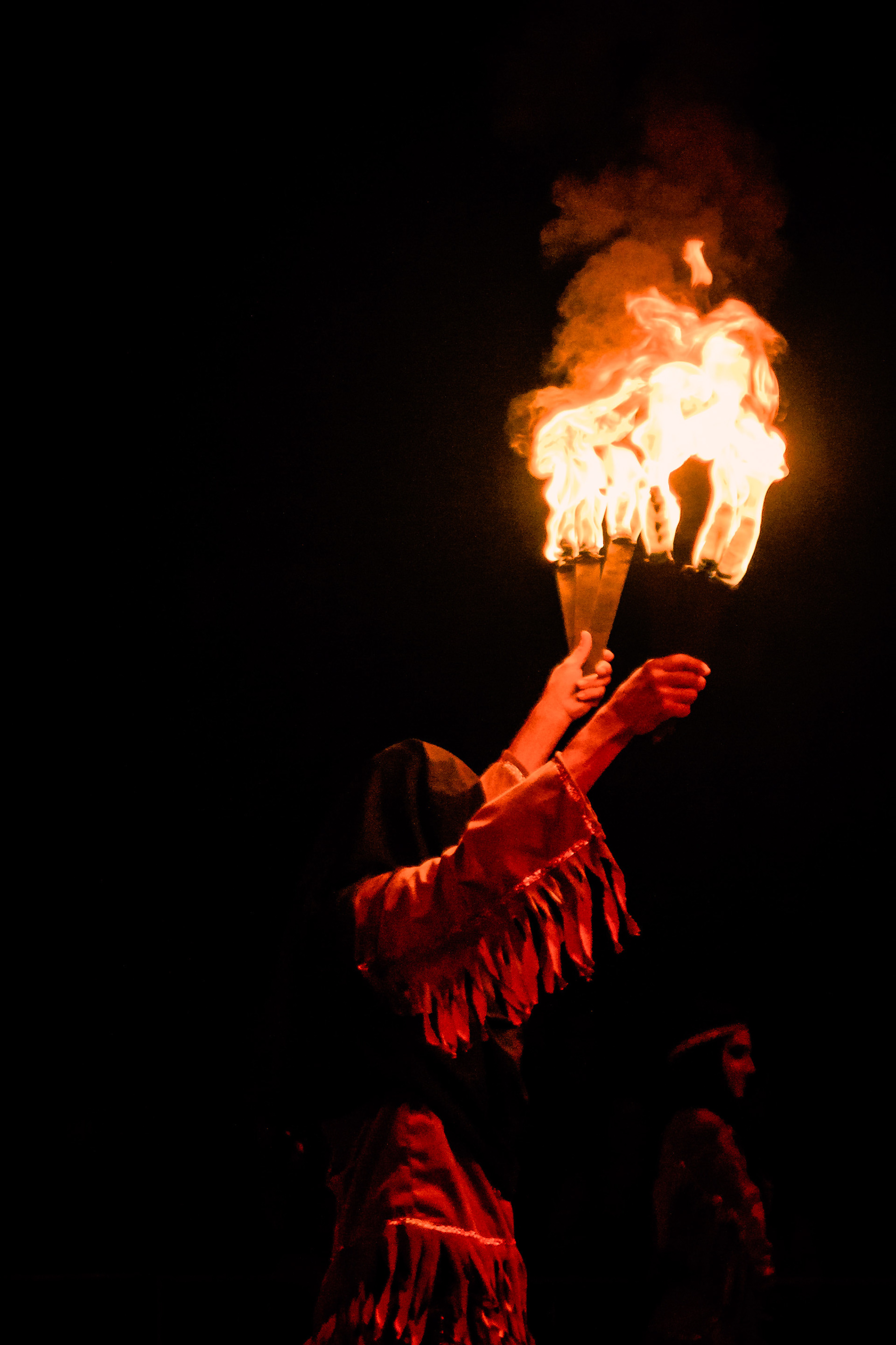 The Fire Man during his performance where he throws knives on fire at a lady in a wheel without hitting her. Caracas 2015