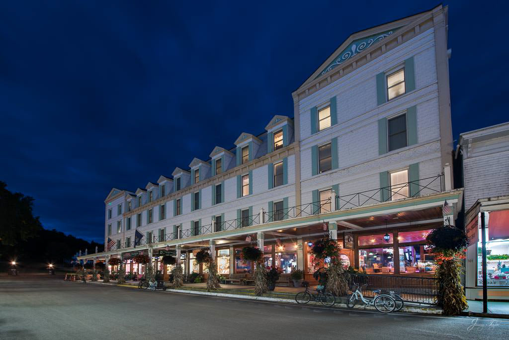 Mackinac Island at night on Main Street with Chippewa Hotel and Pink Pony restaurant