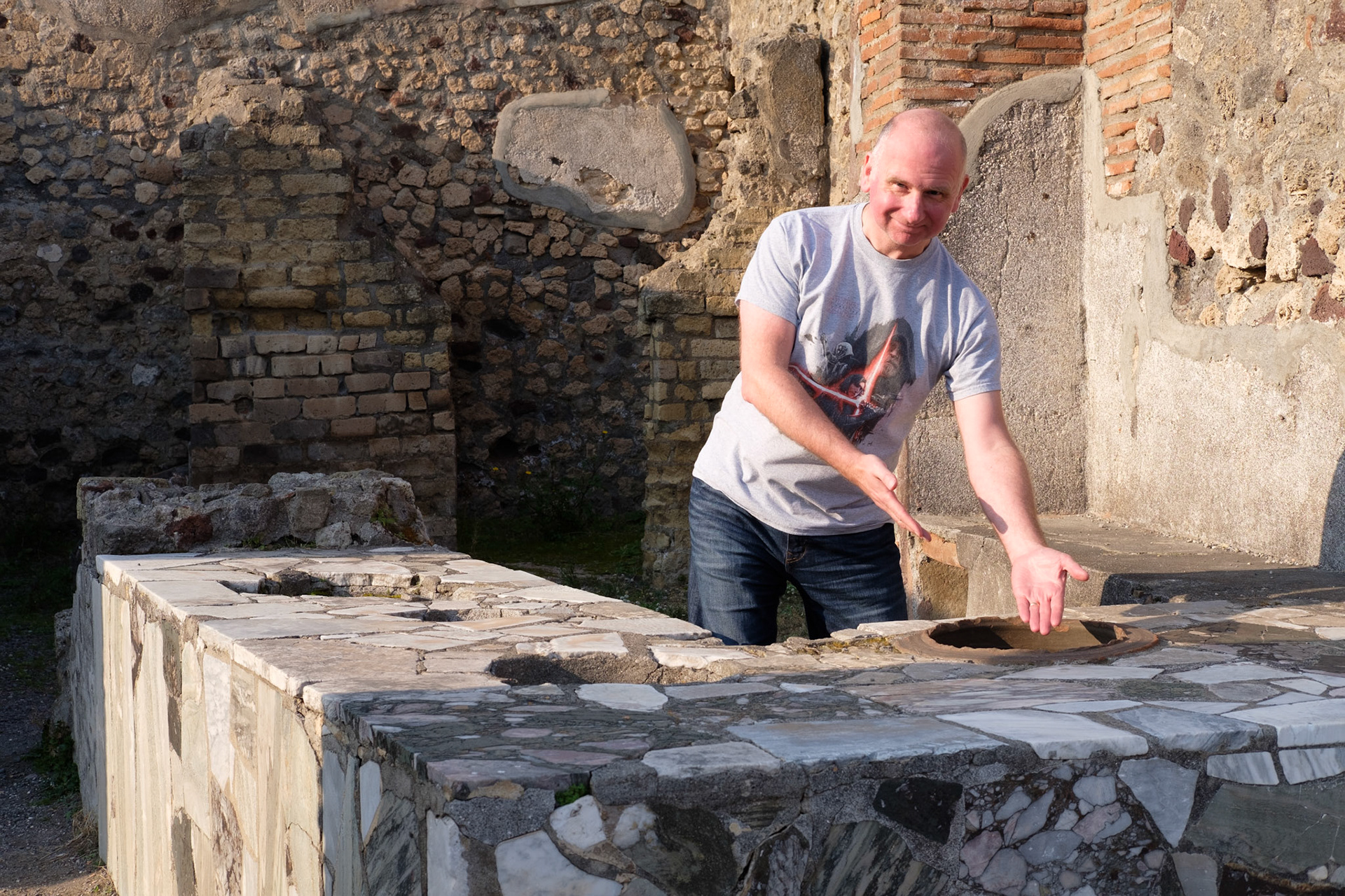 Alex at a shop counter