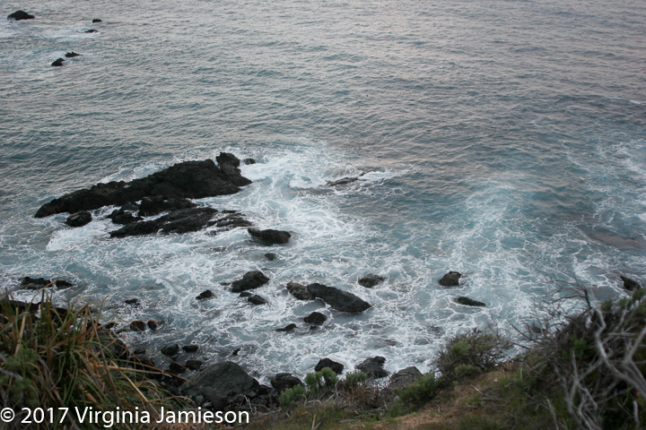 swirling tide with rocks in California coast; UA-92916515-1