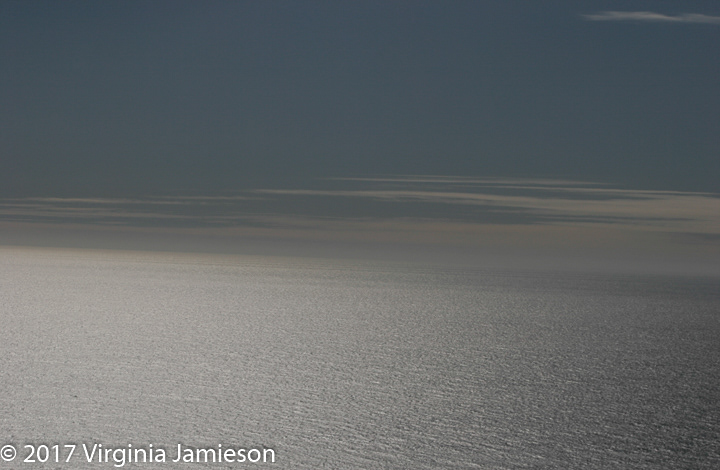 Pacific Ocean at Big Sur meeting with the sky; UA-92916515-1