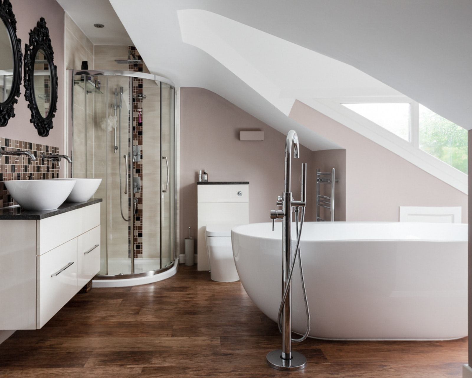 Beautifully designed bathroom with lush green views