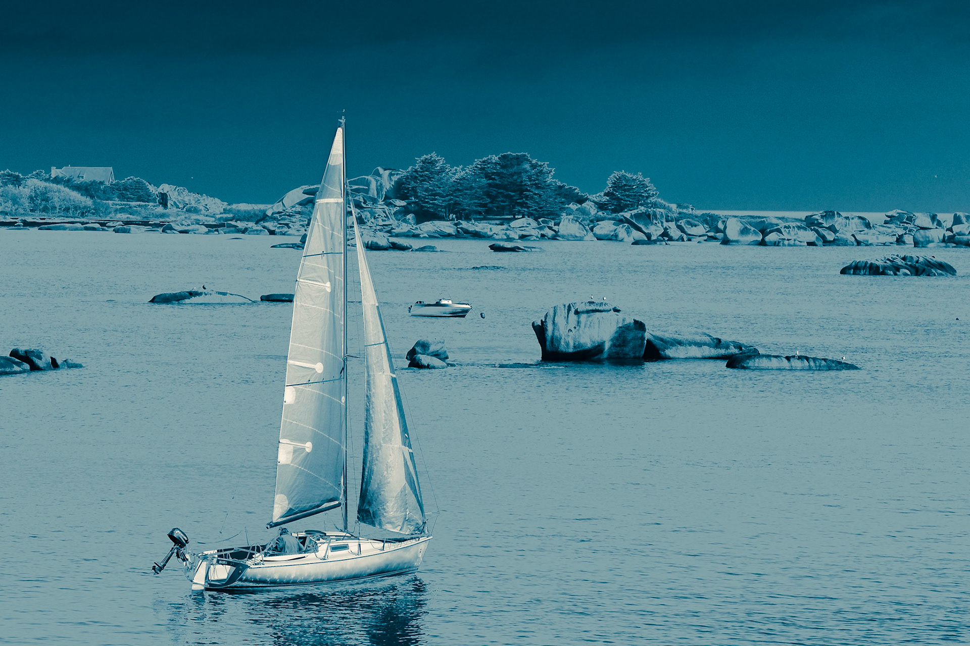 Aqua-tint processing of a sea-side scene featuring a small sailboat on the English channel in Bretagne.