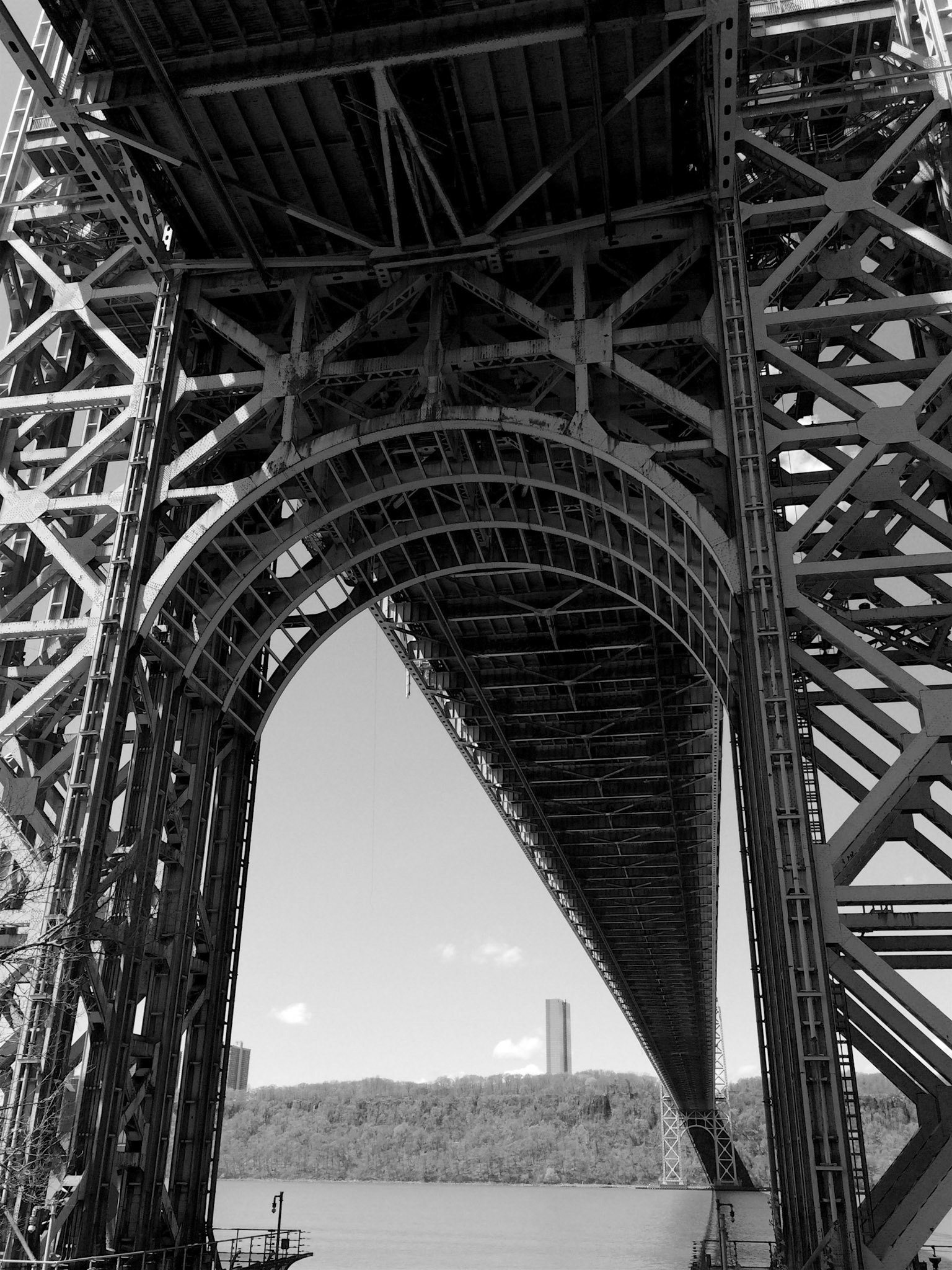 Looking up at one of the towers on the George Washington Bridge, seen in black and white