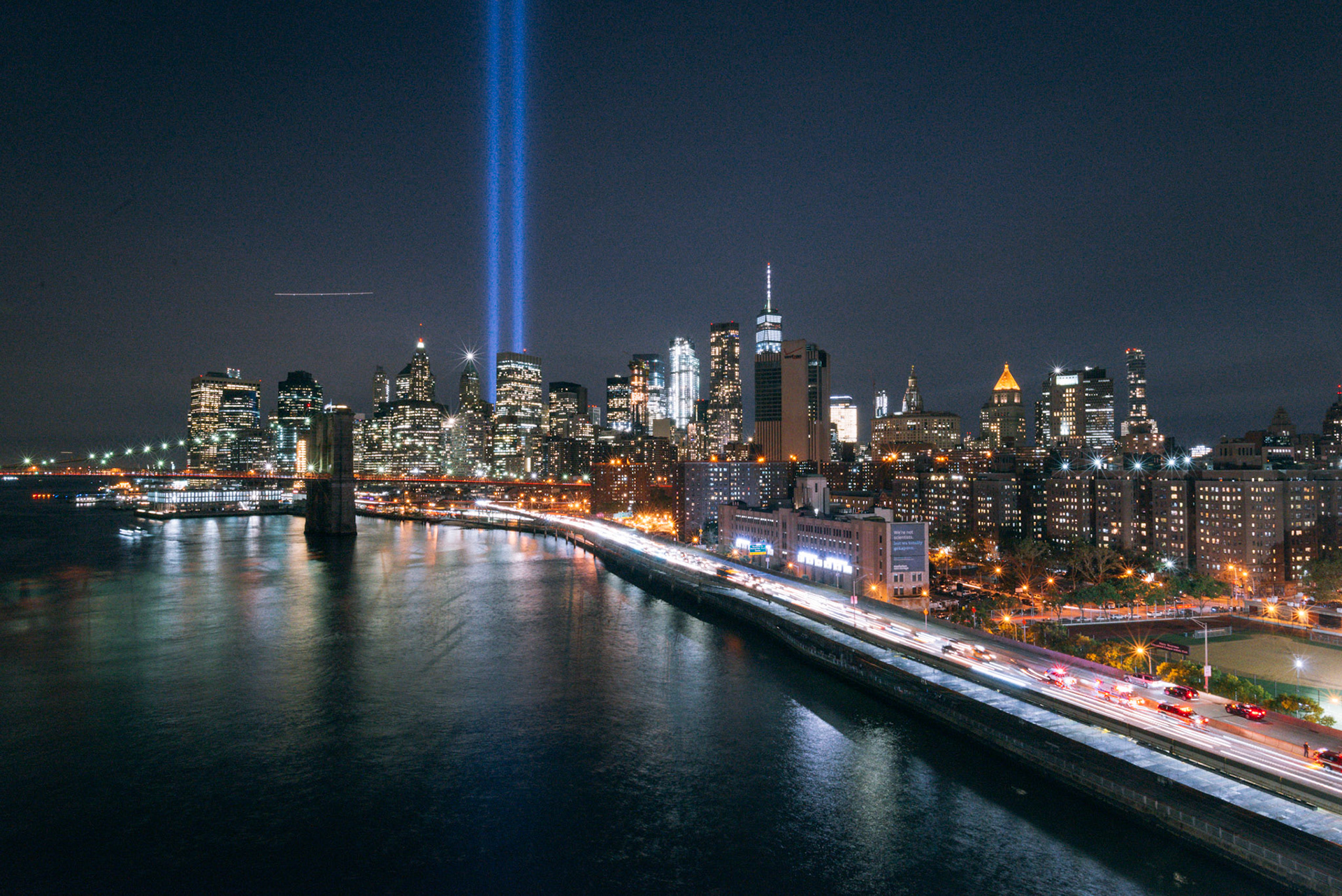 Lower Manhattan skyline and Tribute in Lights from the Manhattan Bridge