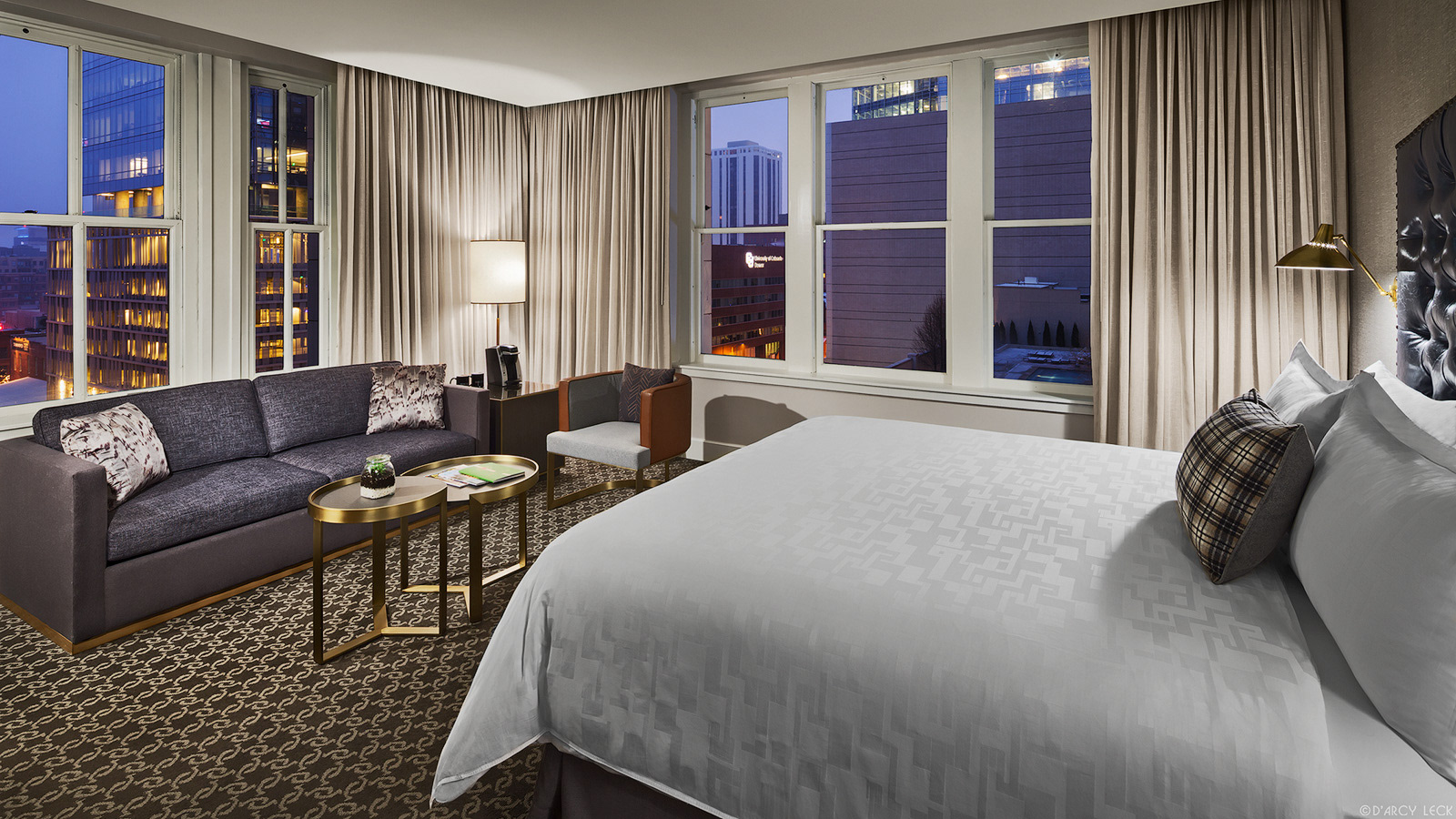 Hotel Teatro corner suite guest room at dusk