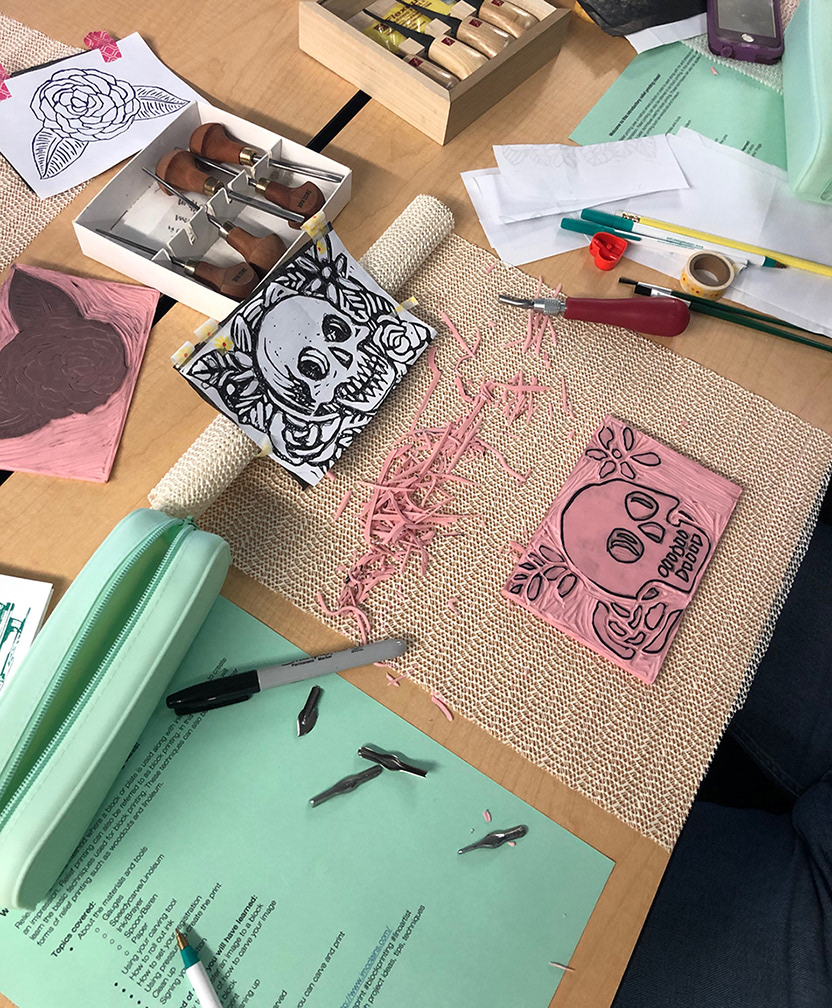 Skull and the printout the student used as inspiration.